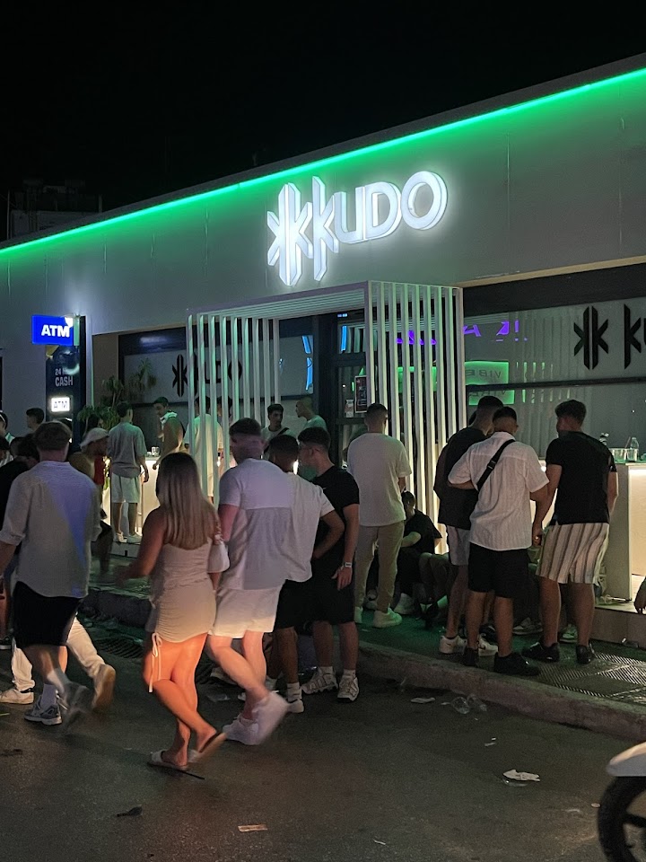 Kudo Club's neon entrance on the Malia strip at night