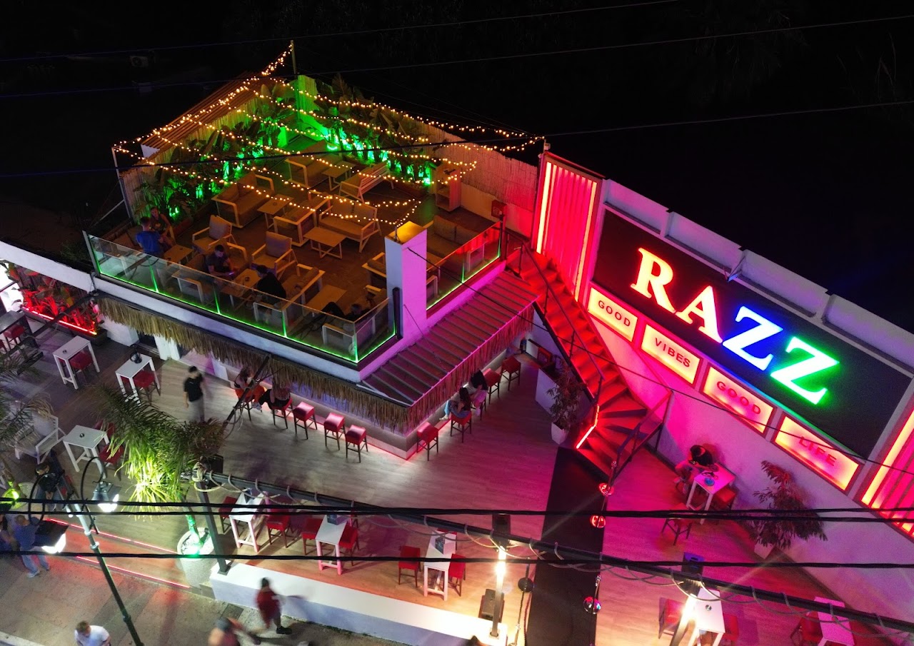 Aerial view of the Razz rooftop terrace at night in Malia